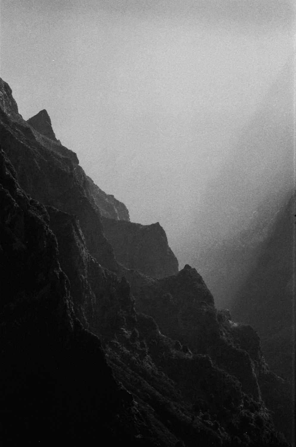 Dark volcanic cliffs, black and white